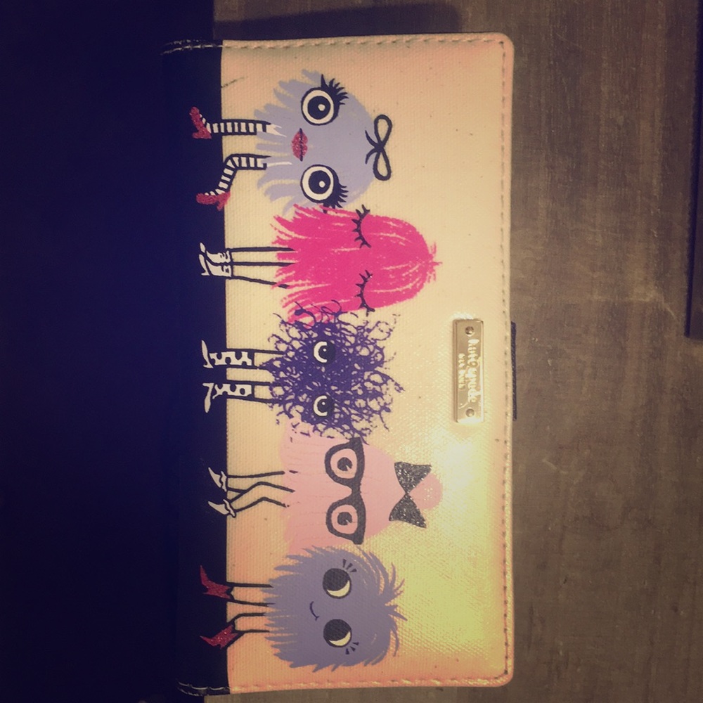 Super cute Kate Spade wallet. Minor marks.